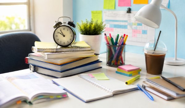 Best Exam Preparation Strategies for Students Student studying with notes and flashcards for exam preparation