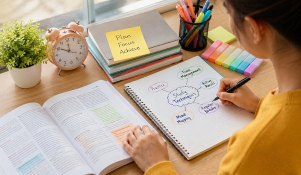 Best Study Techniques That Actually Work Student using flashcards and active recall study techniques at a desk
